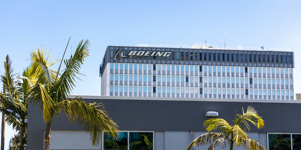 a building with palm trees in front of it