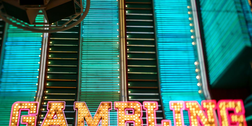 yellow and pink Gambling lighted signage